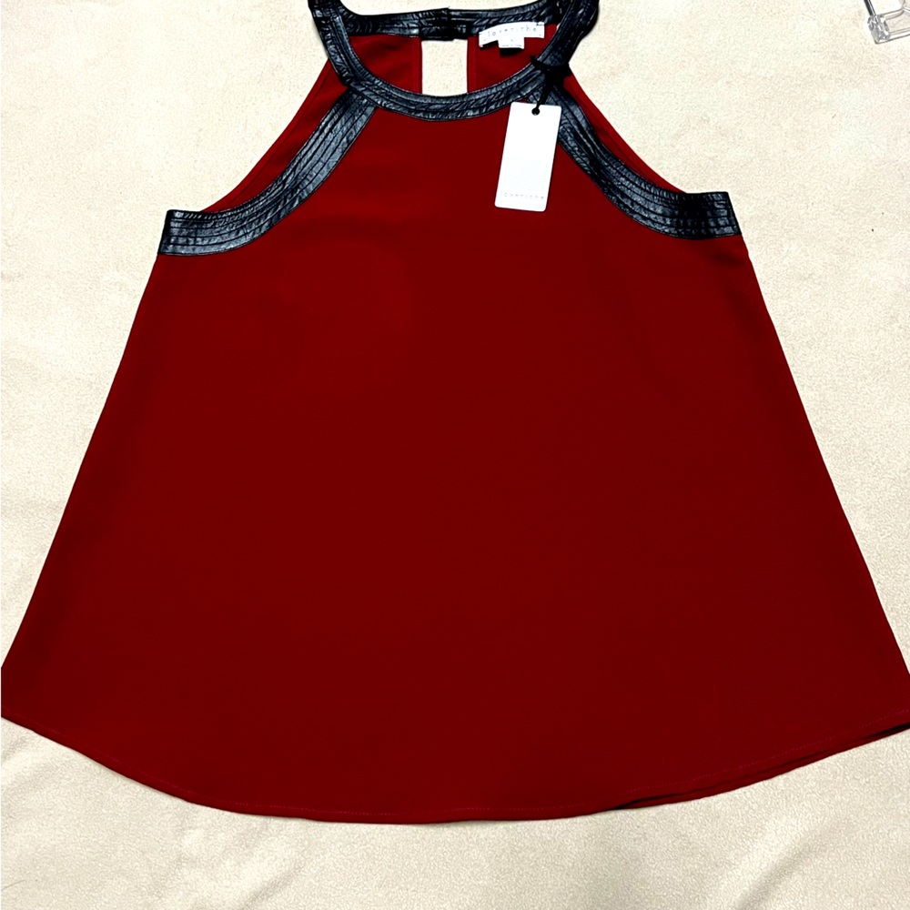 Cranberry flare halter top with faux leather trim.Small